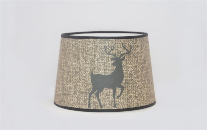 Bring a touch of rustic charm to any lamp. This new shade from Aladdin features a majestic buck deer silhouette on a warm burlap textured background. 12" base diameter, this style of Parchment (Paper) shade does not have a built-in tripod. 12" tripod/shad