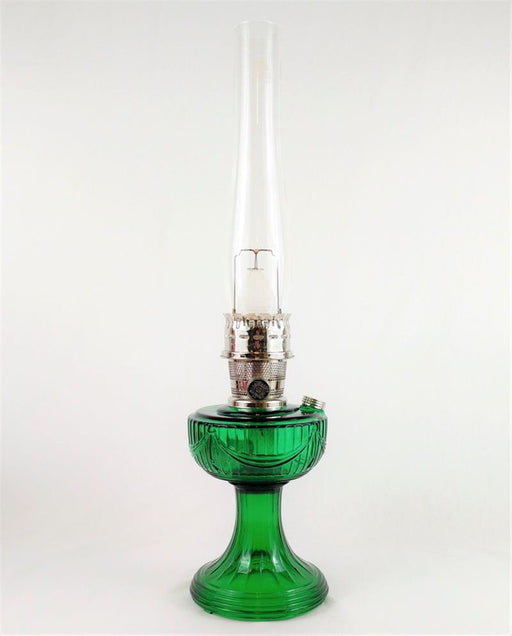 Bring vintage-style beauty to your home with the Aladdin Lincoln Drape Lamp. This gorgeous oil lamp features a sweeping, dramatic font design that has been a staple since its induction in 1939.