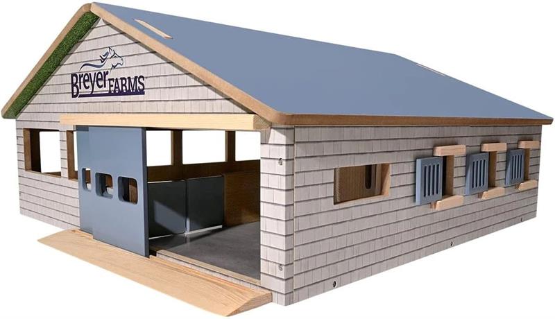 We have an exciting new wood playset in our Breyer Farms line - the Deluxe Arena Stable! It features removable two-sided roof panels, working doors and windows, three stalls with food trays, and a horse wash area. The inside of the roof panels are decora