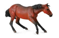plastic toy horse in cutting pose, brown toy figurine horse