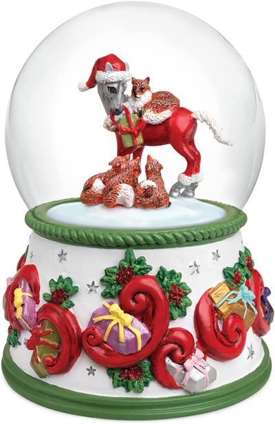 The snow globe’s decorative base is covered with swirls, holly, and presents for a beautiful look from any direction. Swirl the globe to make the snowflakes fall on this charming scene. Wind it up to hear it play “We Wish You a Merry Christmas.”